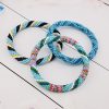 3 nepal roll on bracelets in blue, white and multicolor bead patrern