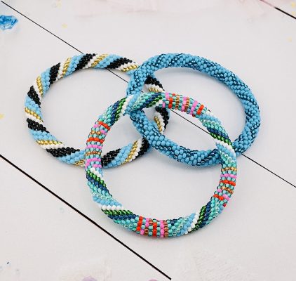 3 nepal roll on bracelets in blue, white and multicolor bead patrern